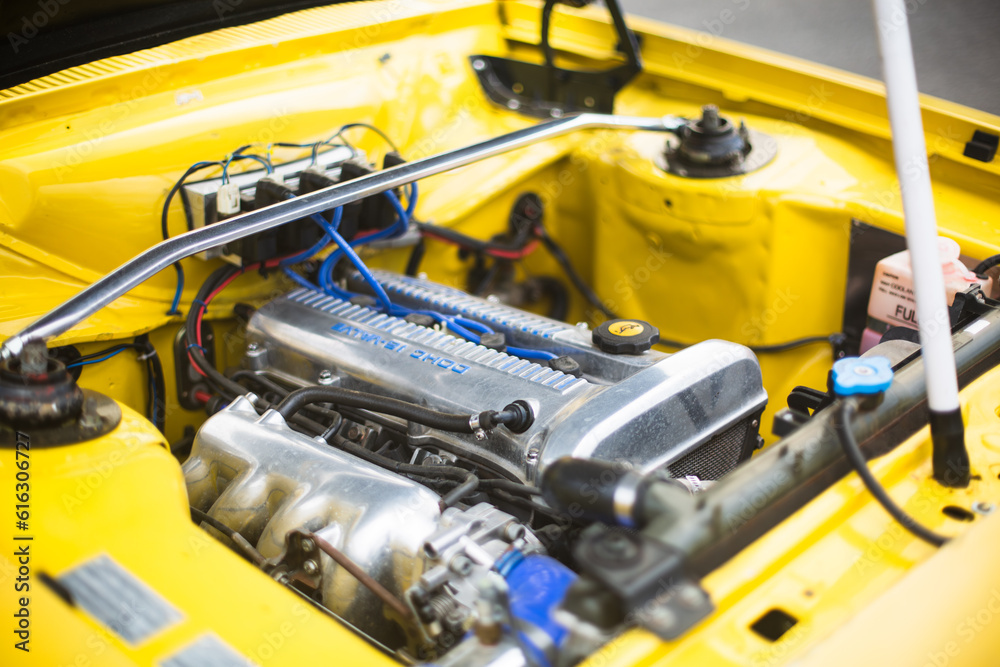 Yellow race car engine detail.