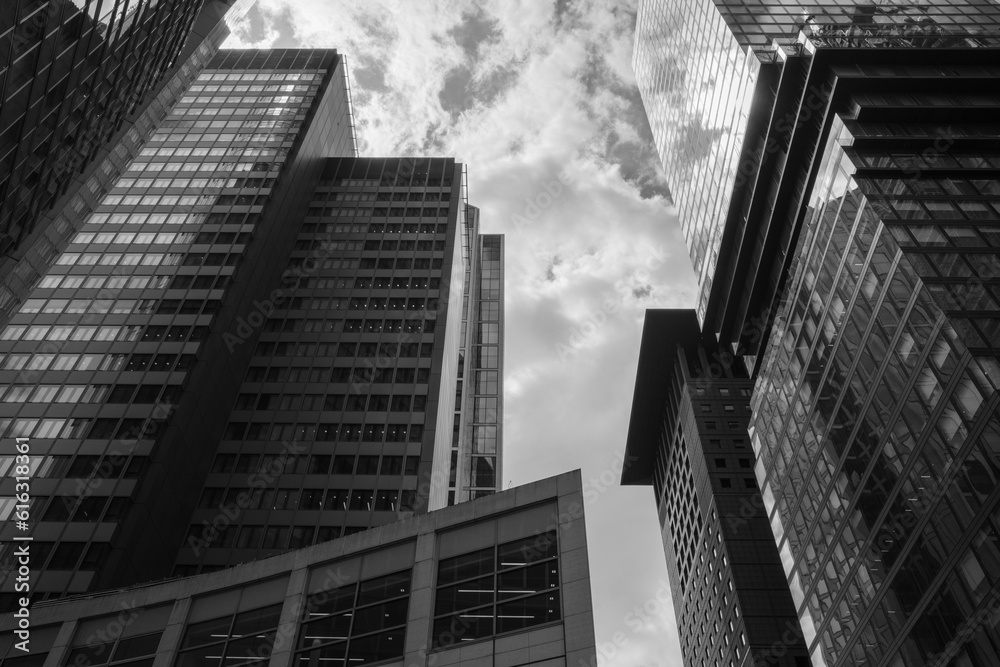 Black and white tone dramatic sky, Low angle view of modern skyscrapers, High rise building in downtown district of Frankfurt, Germany. Black and white tone dramatic sky, Low angle view of modern skyscrapers, High rise building in downtown district of Frankfurt, Germany.