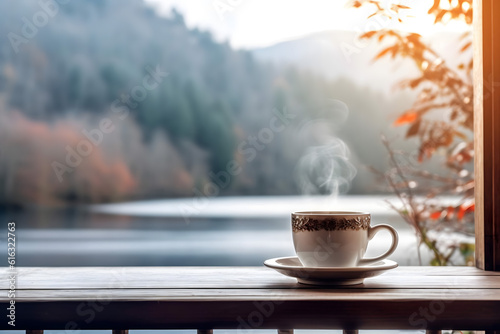 cup of coffee on a window view on lake