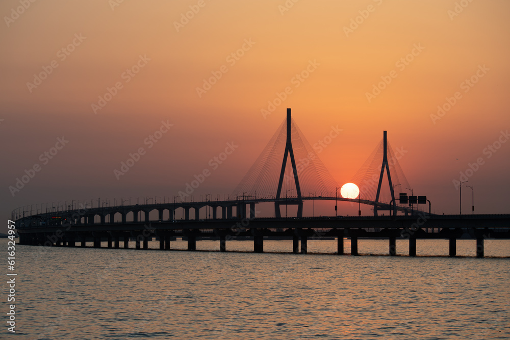 Obraz premium bridge and sunset over the sea