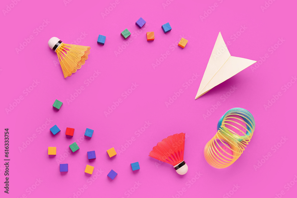 Frame made of toys on pink background. Children's Day celebration