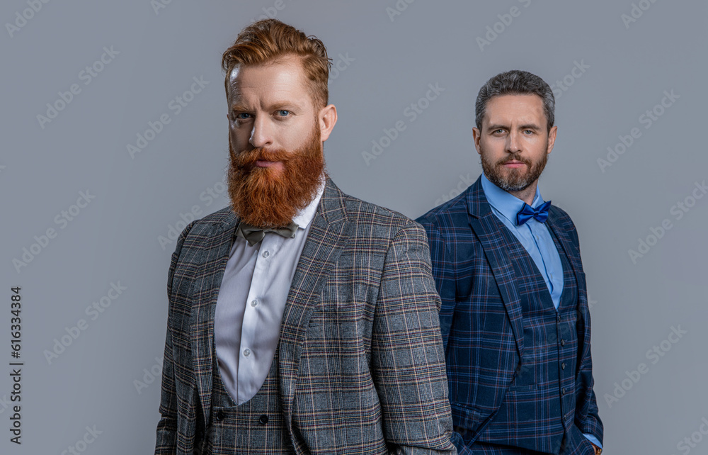 selective focus of men in tuxedo menswear at studio. men in tuxedo menswear selective focus of men in tuxedo menswear at studio. men in tuxedo menswear