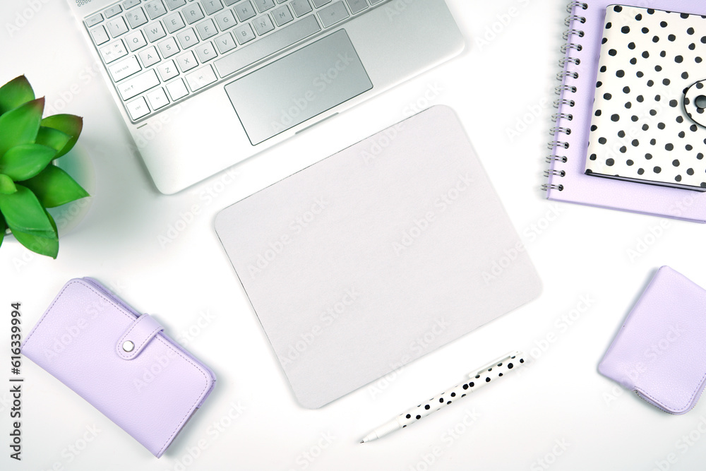 Mouse pad mockup. Styled with computer keyboard and modern desktop accessories. Negative copy space. Mouse pad mockup. Styled with computer keyboard and modern desktop accessories. Negative copy space.