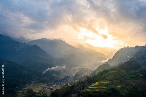 Beautiful landscape with mountains and green rice terraces at sunset in Sapa, Vietnam