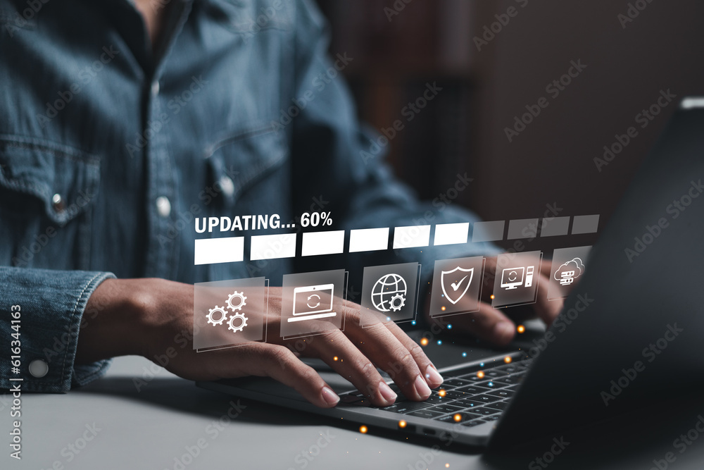 Businessman working and installing update process. Software updates or operating system upgrades to keep your device up to date with enhanced functionality in new versions and improved security. - obrazy, fototapety, plakaty 