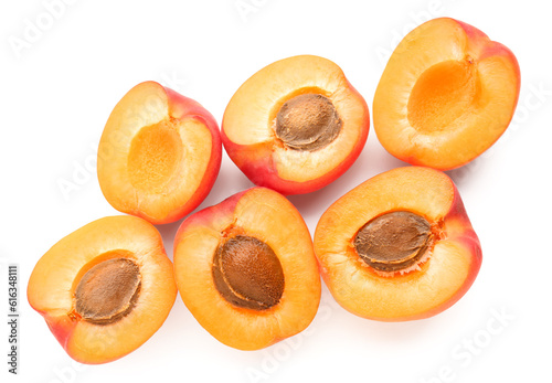 Halves of ripe apricot isolated on white background