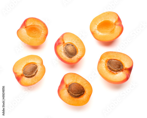 Halves of ripe apricot isolated on white background