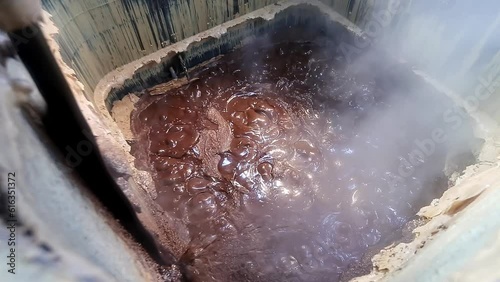 Purifying and dissolving crude soap in factory chambers with chemicals and ingredients