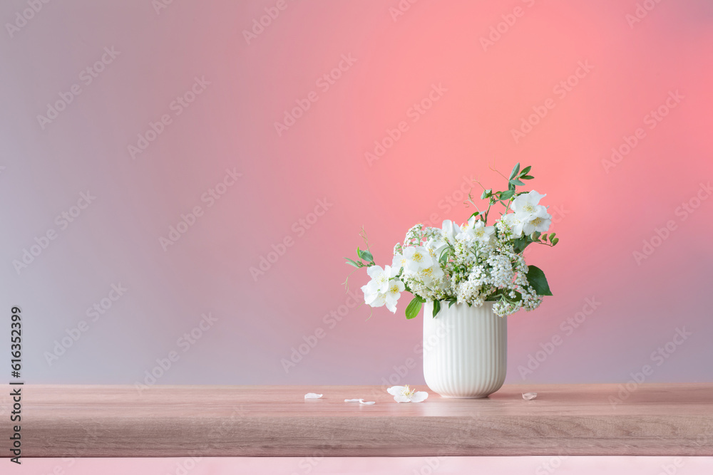 white summer flowers on pink background