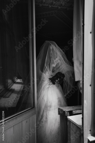 Fear night,ghost mysterious woman in white dress standing in abandon house near door,horror background for halloween