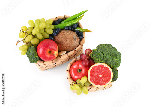 Fototapeta Naklejka Na Ścianę i Meble -  Wicker baskets with different fresh fruits and vegetables on white background