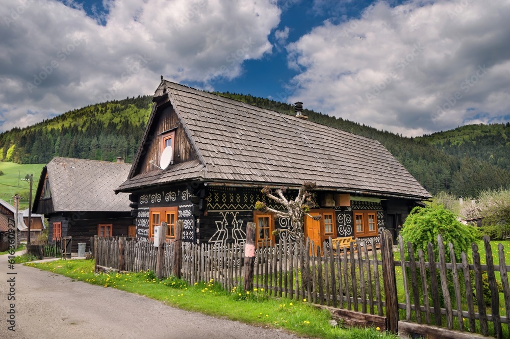 Obraz premium Village with old wooden houses in Slovakia village Cicmany. Čičmany is a village in Slovakia in the district of Žilina