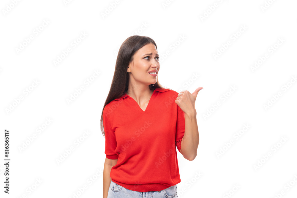 surprised brunette woman in a red stylish v-neck blouse shows her hand to the empty space surprised brunette woman in a red stylish v-neck blouse shows her hand to the empty space