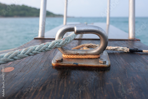 White rope attached to stainless steel on the boat