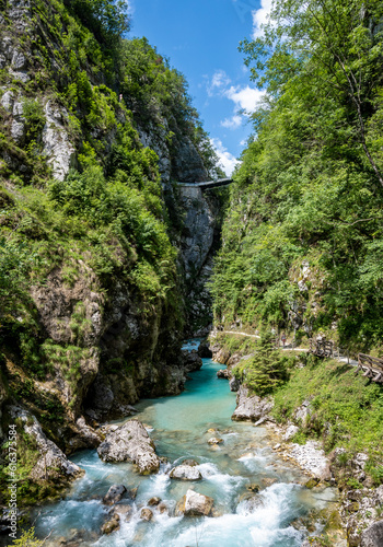 Bridge suspended high above the Soca river canyon, cut deep in the slovenian Alps region