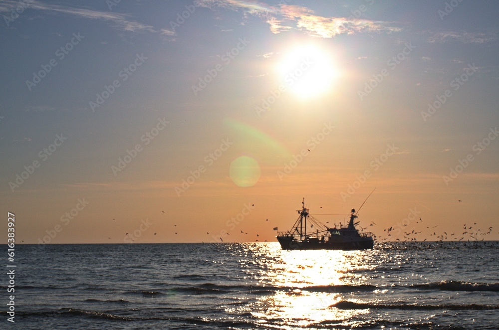 Trawler on the north sea at sunset