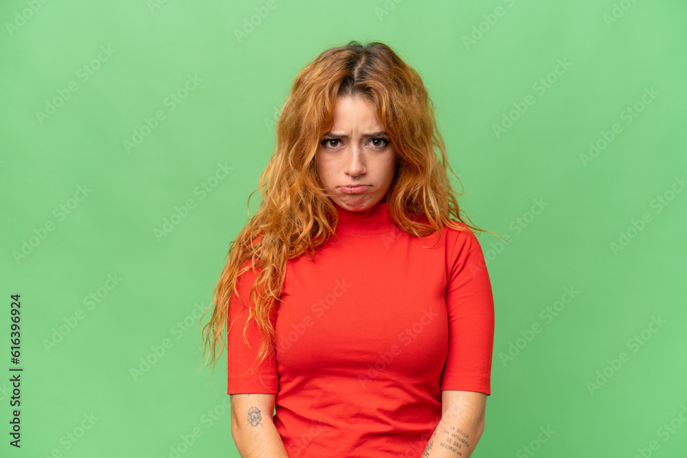 Young caucasian woman isolated on green screen chroma key background with sad expression Young caucasian woman isolated on green screen chroma key background with sad expression