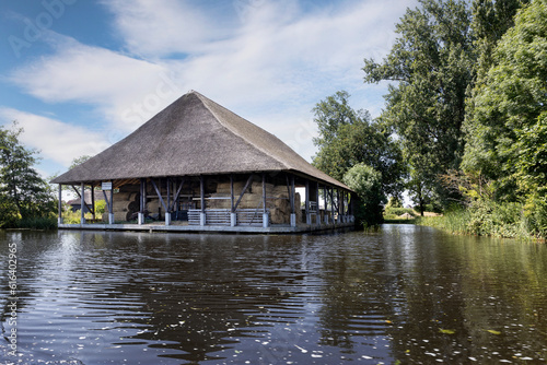 Reet shed Zwartsluis at canal.. Near Giethoorn. National park de Wieden and Weerribben Netherlands. Arembergergracht. Netherlands.