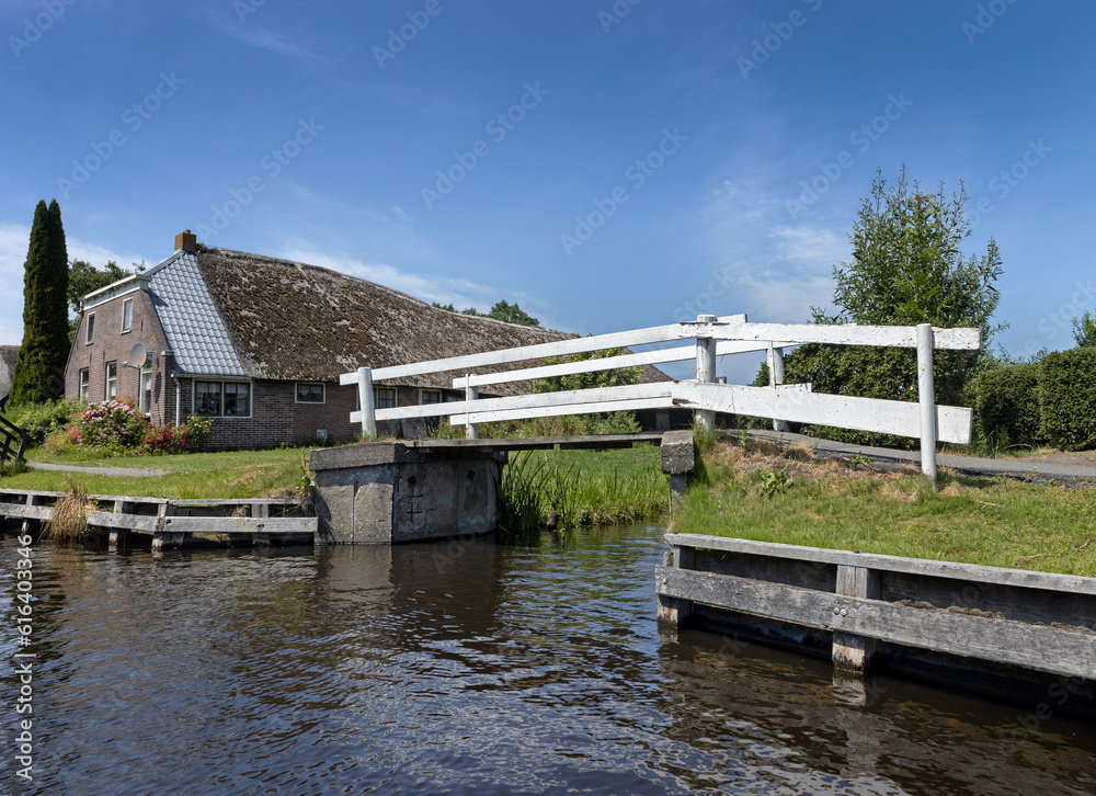 Bridges and houses in Belt Schutsloot. Near Giethoorn. National park de Wieden and Weerribben. Netherlands.