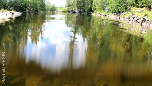 Lake in the forest. Diving under water. Reflection in water. The magical nature of Canada. Mississippi River, Canada