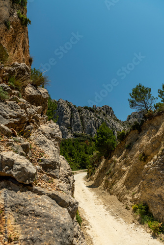 Pass del Comptador, the pass between Sella and Guadalest, small gravel mountain road used by cyclists, Costa Blanca, Alicante, Spain  - stock photo © Amaiquez