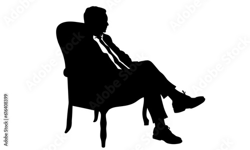 Silhouette of a man sitting in a modern armchair with one leg over his knee