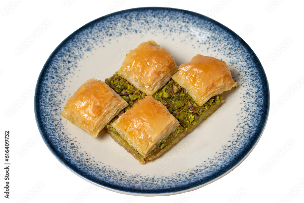 Pistachio baklava isolated on white background. Turkish cuisine delicacies. Turkish baklava. close up Pistachio baklava isolated on white background. Turkish cuisine delicacies. Turkish baklava. close up