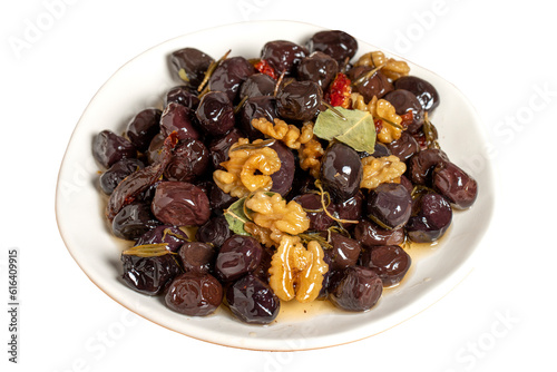 Mixed olives isolated on white background. Black olives prepared with walnuts and spices. Gourmet delicacies. close up