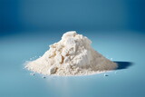pile of white powder isolated on blue plain studio background made with generative ai