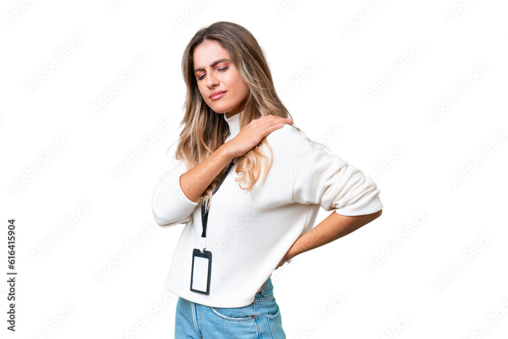 Young Uruguayan woman with ID card over isolated background suffering from pain in shoulder for having made an effort Young Uruguayan woman with ID card over isolated background suffering from pain in shoulder for having made an effort