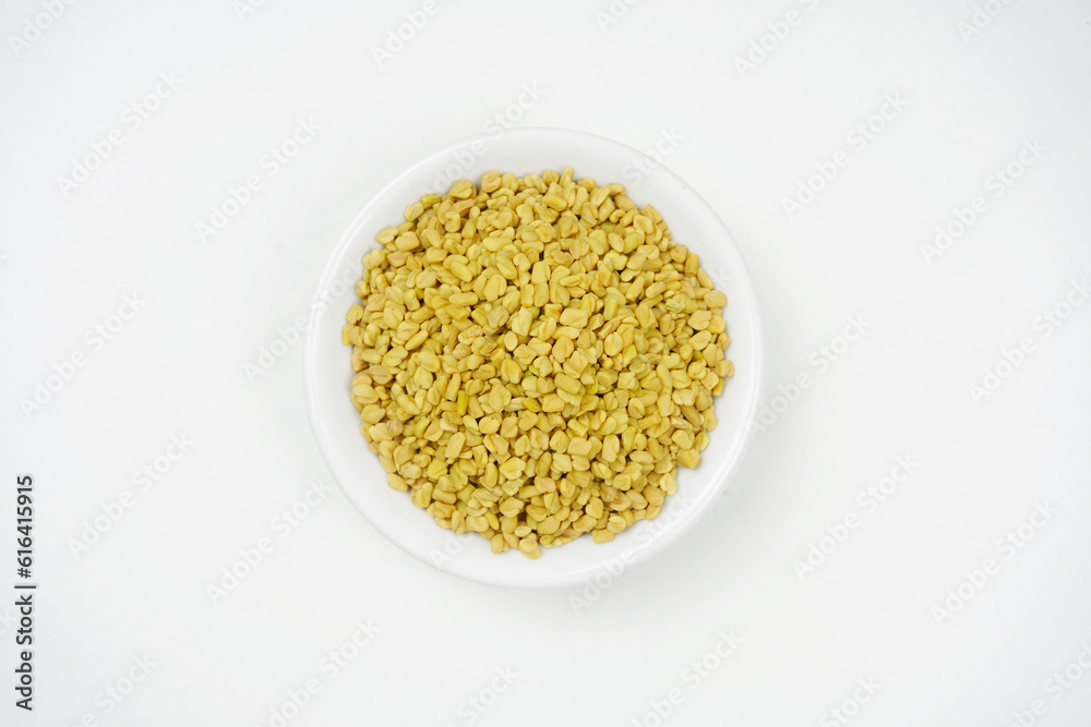 Top view of fenugreek seeds isolated on white background Top view of fenugreek seeds isolated on white background