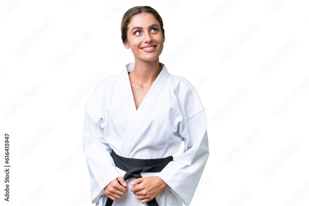 Young Uruguayan woman over isolated background looking up while smiling Young Uruguayan woman over isolated background looking up while smiling