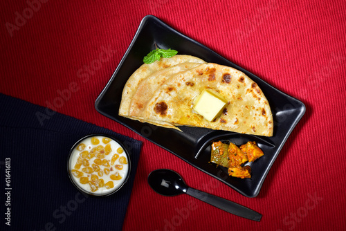 Aloo paratha with raita and achar, healthy indian breakfast