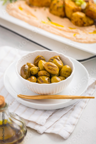Grilled olives with whipped feta, ricotta, cheese dip (Tirokafteri) with crispy baked potatoes