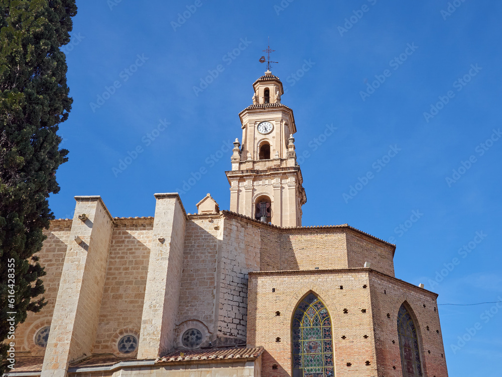 Building of the Collegiate Church of Santa María la Mayor, also called La Seu, and the bell tower with a clock. Gandia, province of Valencia, Spain, Europe