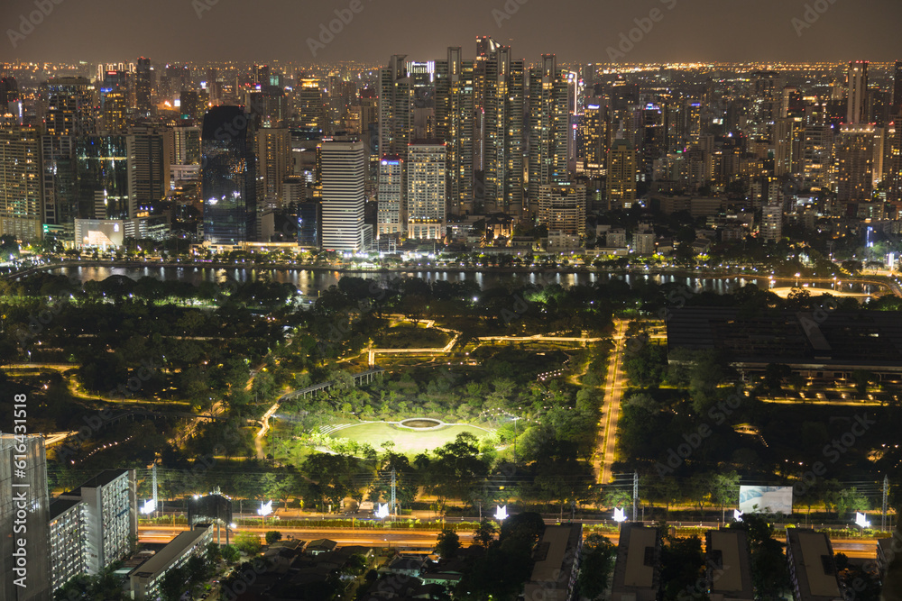 Aerial of Lumpini Park view of highway Road traffic in city at Bangkok thailand Aerial of Lumpini Park view of highway Road traffic in city at Bangkok thailand