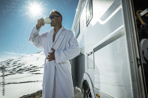 Fresh Morning Coffee Next to Camper Van Before High Mountain Skiing photo