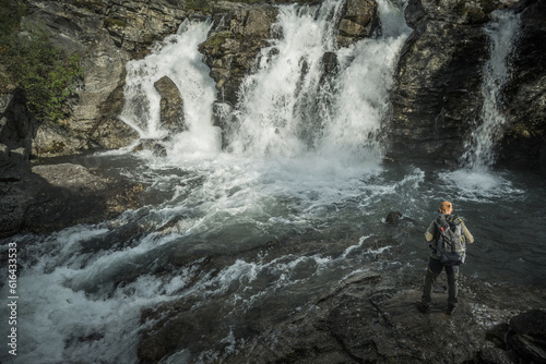 Hiker Exploring River Gorge and the Scenic Waterfalls