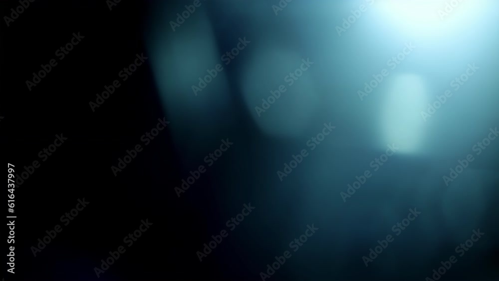Sliding lens flare across top of frame, with blue light leaks and bokeh ...