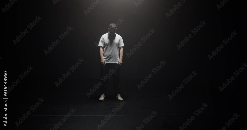 Dancing man taking off headphones Dancing man taking off headphones