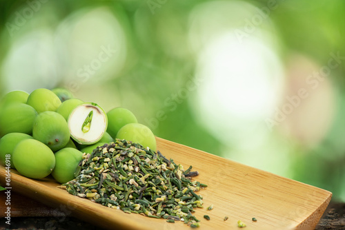 Fresh lotus seeds and dried young plant in the lotus seed on nature background. photo