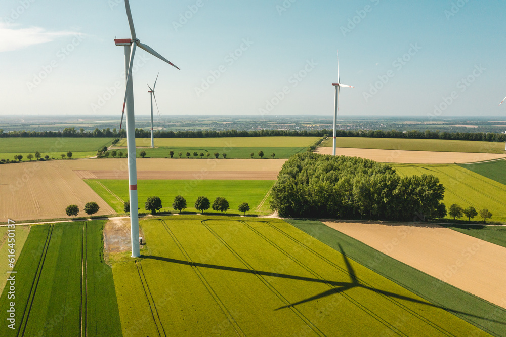landscape with wind turbines in agricultural fields - obrazy, fototapety, plakaty 