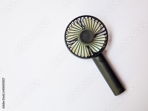 Black portable mini fan isolated on white background.