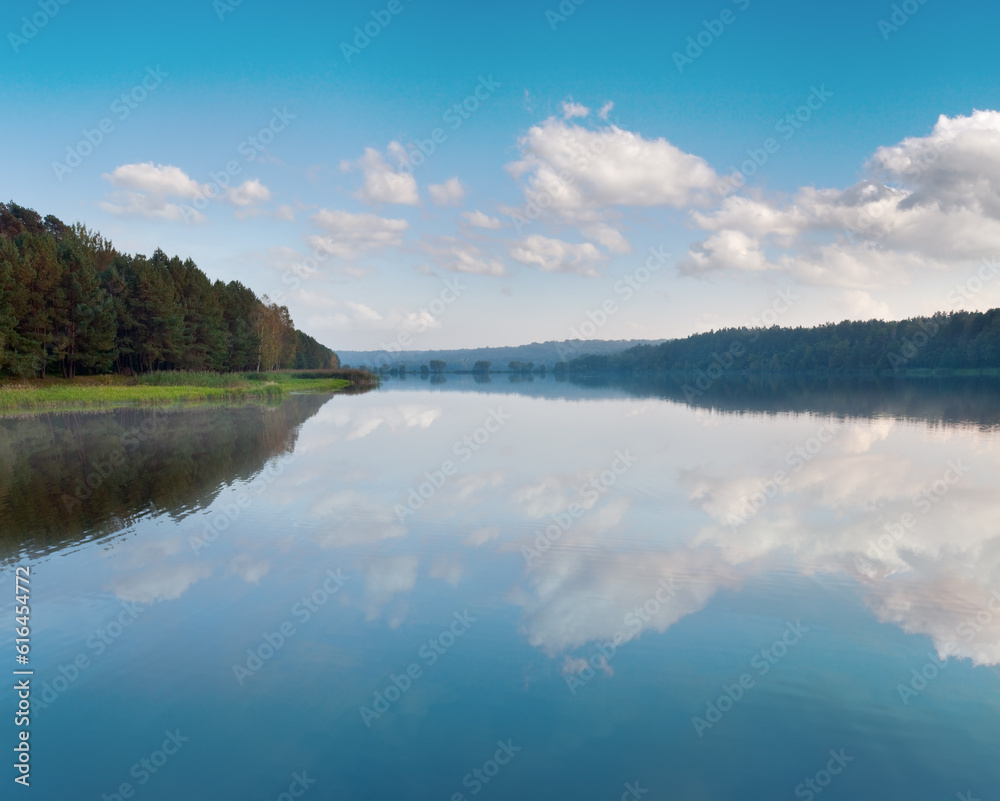 Fototapeta premium Autumn misty evening lake with grove on shore