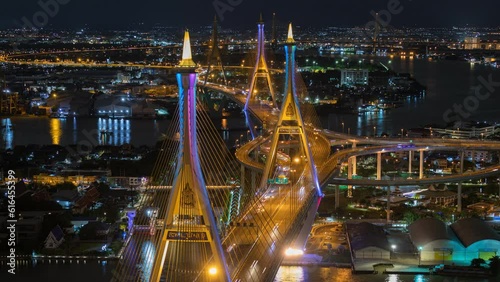 Aerial view of Bhumibol Bridge and Chao Phraya River in structure architecture concept, Urban city, Bangkok. Downtown area at night, Thailand
