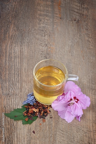  mug of tea with flower on a wooden background 