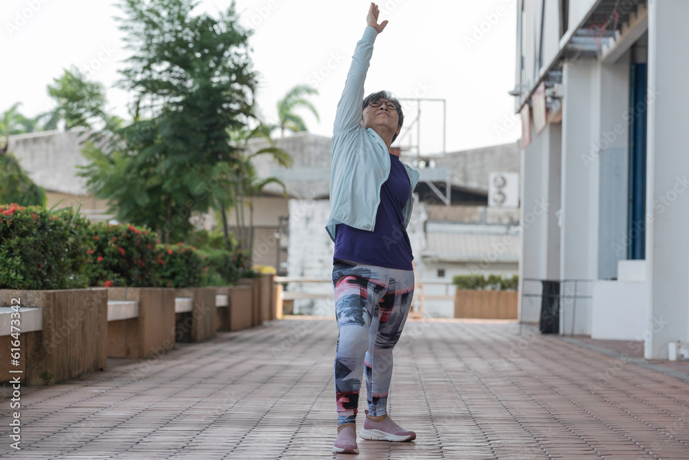 late age woman attractive in sportswear practicing and exercise outdoor in yoga style pose yoga lesson.