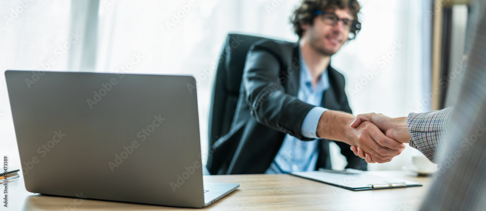 Businessman handshake for teamwork of business merger and acquisition,successful negotiate,hand shake,two businessman shake hand with partner to celebration partnership and business deal concept