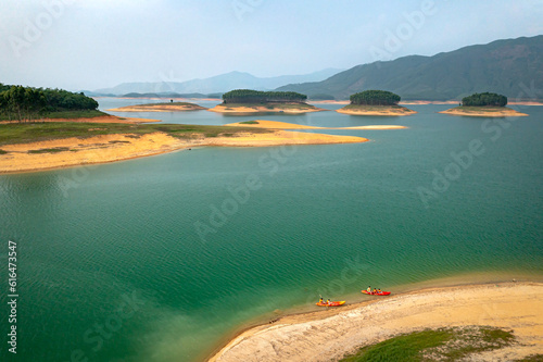 Fototapeta Naklejka Na Ścianę i Meble -  Panoramic view of Thac Ba lake from above. Thac Ba Lake consists of many small islands in Yen Binh district, Yen Bai province, Vietnam. This place attracts a lot of tourists because of its unspoiled b