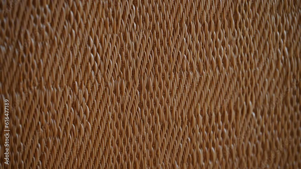 closeup view of brown wicker pattern background texture wooden furniture detail straw handcrafted decoration